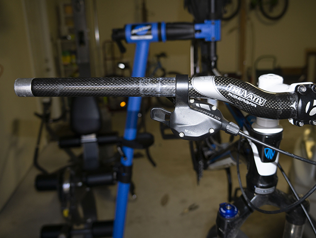 Photograph of 2013 Trek Cobia in Park PCS-10.2 bike repair stand for article about frugality.
